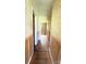 Long hallway with wood floors and floral wallpaper at 1073 Springdale Dr, Maiden, NC 28650
