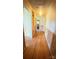 Hallway with hardwood floors, wallpaper, and paneled walls at 1073 Springdale Dr, Maiden, NC 28650