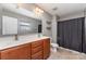 A bathroom with double sinks, wood vanity and a shower tub combo at 12829 Brandenburg Ln, Midland, NC 28107