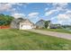 Exterior side view of the home, showcasing its well-kept lawn and inviting curb appeal at 12829 Brandenburg Ln, Midland, NC 28107