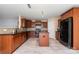 Modern kitchen with dark cabinetry, granite countertops, and stainless steel appliances at 12829 Brandenburg Ln, Midland, NC 28107