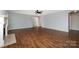 Expansive living room with hardwood floors, featuring an open floor plan and recessed lighting at 12829 Brandenburg Ln, Midland, NC 28107