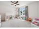 Bright bedroom features plush carpet, large window, and imaginative play area at 1311 Rowan Ln, Monroe, NC 28110