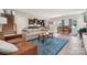 Open-concept living area with hardwood floors, a view of the kitchen, and a dining area at 1311 Rowan Ln, Monroe, NC 28110