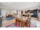 Open-concept living room and kitchen boasts stylish decor, modern appliances, and ample natural light at 1311 Rowan Ln, Monroe, NC 28110