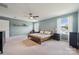 Bright main bedroom has a ceiling fan, neutral tones, and large windows at 1311 Rowan Ln, Monroe, NC 28110