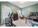 Bright office space features two windows, neutral carpet, and a cozy reading nook at 1311 Rowan Ln, Monroe, NC 28110