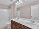 Bathroom with a dual sink vanity, a mirror, and a toilet at 1349 Bridgeford Nw Dr, Huntersville, NC 28078