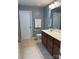 Bathroom featuring a brown vanity with light countertop and a toilet at 1349 Bridgeford Nw Dr, Huntersville, NC 28078