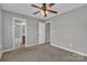 Empty bedroom featuring gray walls, a window, and carpet flooring at 1349 Bridgeford Nw Dr, Huntersville, NC 28078