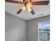 Ceiling fan with lights in a neutral-colored room with a bright window at 1349 Bridgeford Nw Dr, Huntersville, NC 28078
