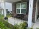Charming front porch with a bench and well-maintained landscaping, providing a cozy curb appeal at 1349 Bridgeford Nw Dr, Huntersville, NC 28078
