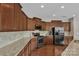 Spacious kitchen with stainless steel appliances, granite countertops, and abundant cabinetry for storage at 1349 Bridgeford Nw Dr, Huntersville, NC 28078
