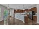 Bright, well-lit kitchen with stainless steel appliances, granite countertops, and ample cabinet space at 1349 Bridgeford Nw Dr, Huntersville, NC 28078