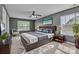 Serene main bedroom boasting natural light, ceiling fan, and stylish decor at 1349 Bridgeford Nw Dr, Huntersville, NC 28078