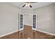 Office space featuring hardwood floors and bright French doors at 1349 Bridgeford Nw Dr, Huntersville, NC 28078