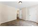 Bedroom with neutral walls, carpet flooring, and a door leading outside of the room at 14402 Raynham Dr, Charlotte, NC 28262