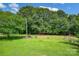Expansive backyard with lush green grass and mature trees, perfect for outdoor activities at 1532 Buffalo Shoals Rd, Claremont, NC 28610