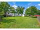 Expansive backyard view with lush green grass, showcasing the home's outdoor space and potential at 1532 Buffalo Shoals Rd, Claremont, NC 28610