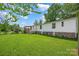 Backyard with a well-maintained lawn and a deck, perfect for outdoor enjoyment and entertaining at 1532 Buffalo Shoals Rd, Claremont, NC 28610