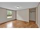 Spacious bedroom with wood floors, a window view to the outdoors and large closet at 1532 Buffalo Shoals Rd, Claremont, NC 28610