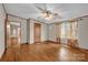 Bright bedroom featuring hardwood floors, neutral walls, and natural light from the large window at 1532 Buffalo Shoals Rd, Claremont, NC 28610