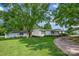 Charming single-Gathering home with a large, lush front yard and detached garage surrounded by mature trees at 1532 Buffalo Shoals Rd, Claremont, NC 28610