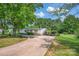 Shot of the home's front exterior and driveway, with a covered parking area and well-maintained landscaping at 1532 Buffalo Shoals Rd, Claremont, NC 28610