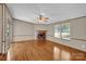 Inviting living room with hardwood floors, a fireplace, and access to a sliding glass door at 1532 Buffalo Shoals Rd, Claremont, NC 28610