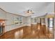 Spacious living room with hardwood floors, a fireplace, and large windows for ample natural light at 1532 Buffalo Shoals Rd, Claremont, NC 28610
