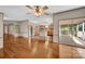 Open-concept living space featuring hardwood floors seamlessly connecting the living room and kitchen area at 1532 Buffalo Shoals Rd, Claremont, NC 28610