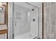 Modern tiled shower with white subway tile and glass door, offering a spa-like experience at 1532 Buffalo Shoals Rd, Claremont, NC 28610