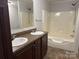 Bathroom featuring double vanity with large mirror and a tub and shower combo at 1555 Moore Rd, York, SC 29745