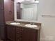 Bathroom with double vanity, ample cabinet storage, and a large mirror above the sinks at 1555 Moore Rd, York, SC 29745