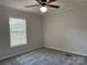 Bedroom with neutral walls, plush carpet and a window for natural light at 1555 Moore Rd, York, SC 29745