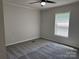 Bedroom with neutral walls, plush carpet and a window for natural light at 1555 Moore Rd, York, SC 29745