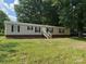 Single story home with level lawn and front porch at 1555 Moore Rd, York, SC 29745