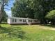 Inviting single story home with green lawn and classic black shutters at 1555 Moore Rd, York, SC 29745