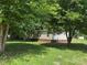 Back view of charming single story home with brick foundation and level lawn at 1555 Moore Rd, York, SC 29745