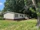 Charming single story home with black shutters and wooden front porch at 1555 Moore Rd, York, SC 29745