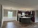 Open kitchen and dining area with center island and stainless appliances at 1555 Moore Rd, York, SC 29745