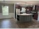 Open kitchen with stainless steel appliances, kitchen island, and dining area at 1555 Moore Rd, York, SC 29745