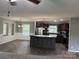 Open kitchen with center island, stainless appliances, and adjacent dining area at 1555 Moore Rd, York, SC 29745