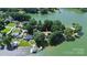 Aerial view of lake house featuring lush trees and waterfront access at 160 Quail Hollow Dr, Kings Mountain, NC 28086