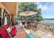 Large deck overlooking the lake offers a relaxing seating area with scenic views; perfect for outdoor dining at 160 Quail Hollow Dr, Kings Mountain, NC 28086