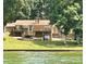 Lakeside home with multiple decks, perfect for outdoor entertaining and enjoying the water views at 160 Quail Hollow Dr, Kings Mountain, NC 28086