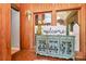 Foyer featuring brick flooring, wood paneling, and decorative furniture at 160 Quail Hollow Dr, Kings Mountain, NC 28086
