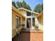 Charming front entrance with brick walkway, stylish door, sidelights, and decorative plants at 160 Quail Hollow Dr, Kings Mountain, NC 28086