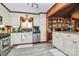 This kitchen offers vintage charm, ample counter space, stainless appliances, and bright natural light at 160 Quail Hollow Dr, Kings Mountain, NC 28086
