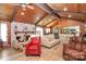 Open living area with wood-paneled walls, vaulted ceilings, and easy access to kitchen at 160 Quail Hollow Dr, Kings Mountain, NC 28086